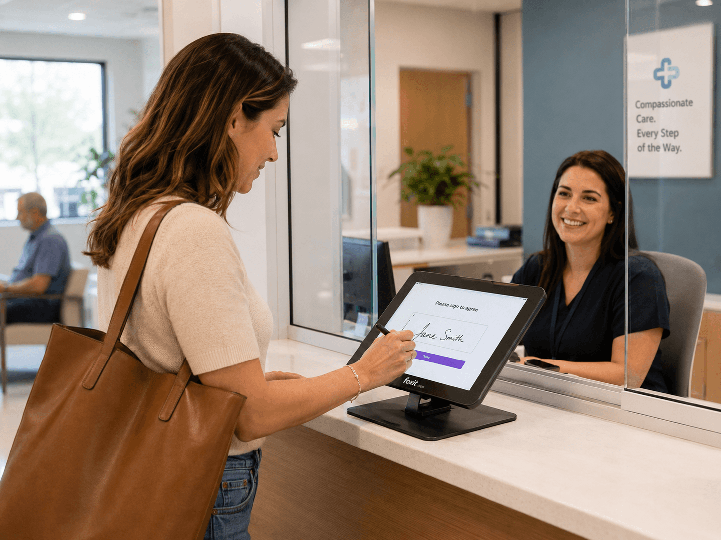 Foxit eSign In-Person Signing — representative hands tablet to customer for electronic signature